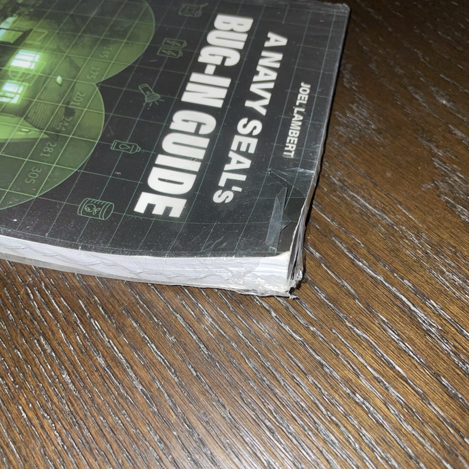 A Navy Seals BUG IN GUIDE SEALED but bent