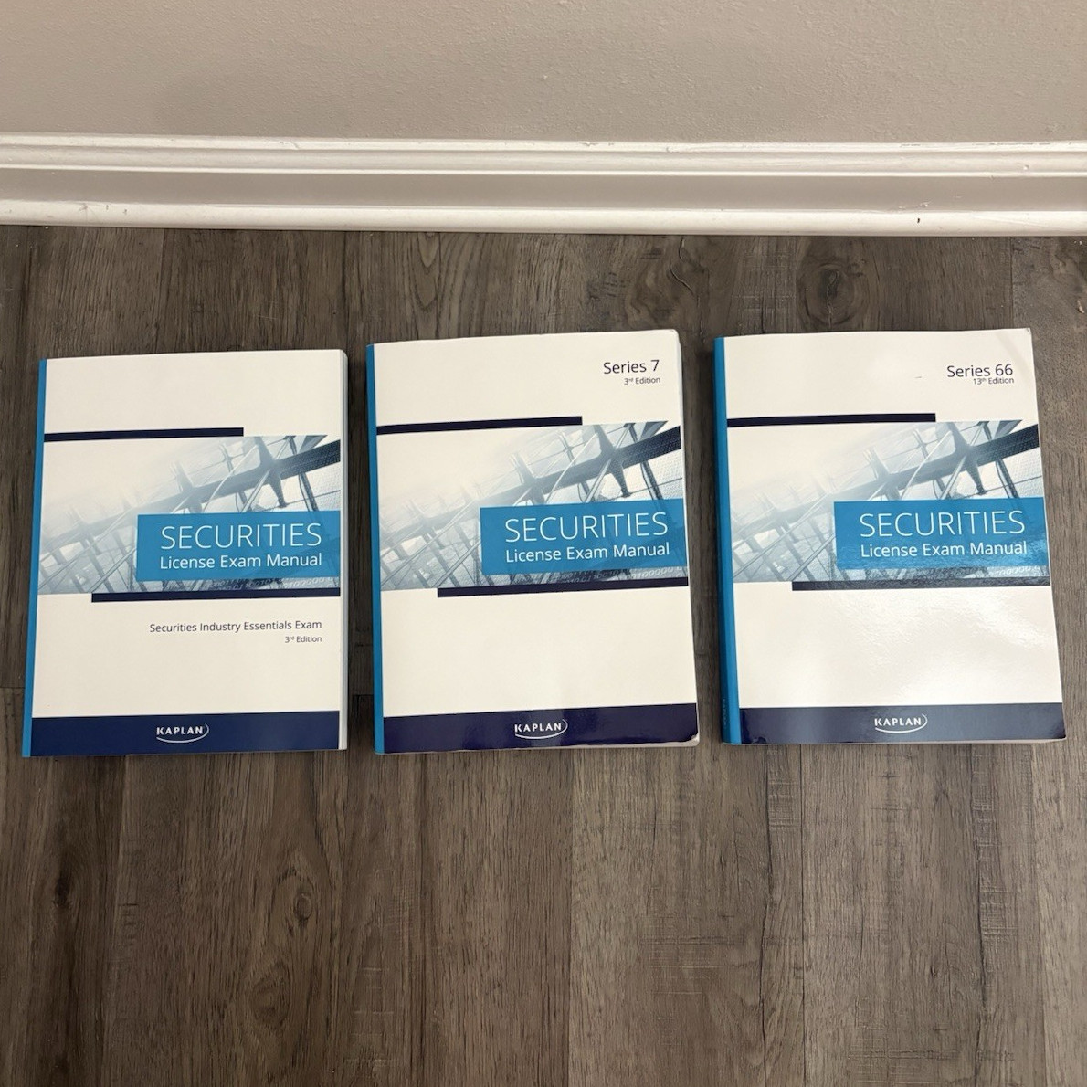 UNUSED Kaplan Securities License Exam Manual: SIE 3rd, Series 7 3rd, 66 13th